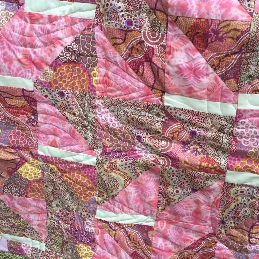 NWT. Hand Crafted Pinks Aboriginal Prints Quilt
